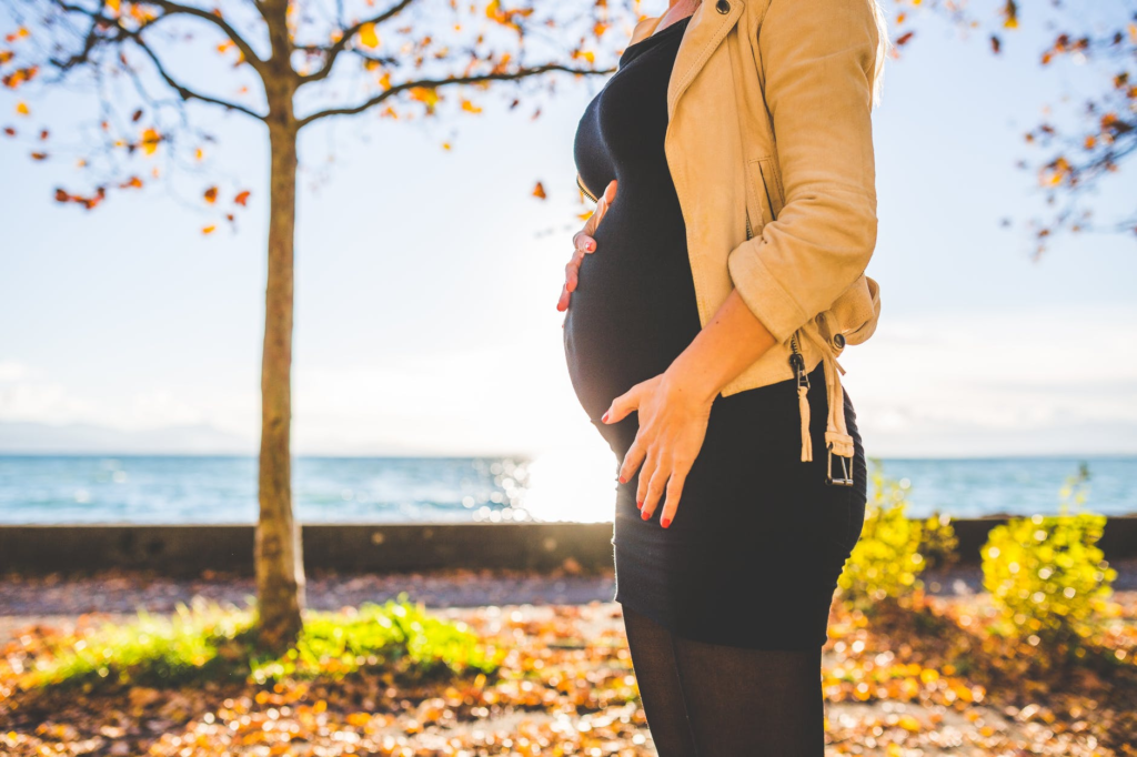 Pregnancy women taking picture - Joy of Life Surrogacy
